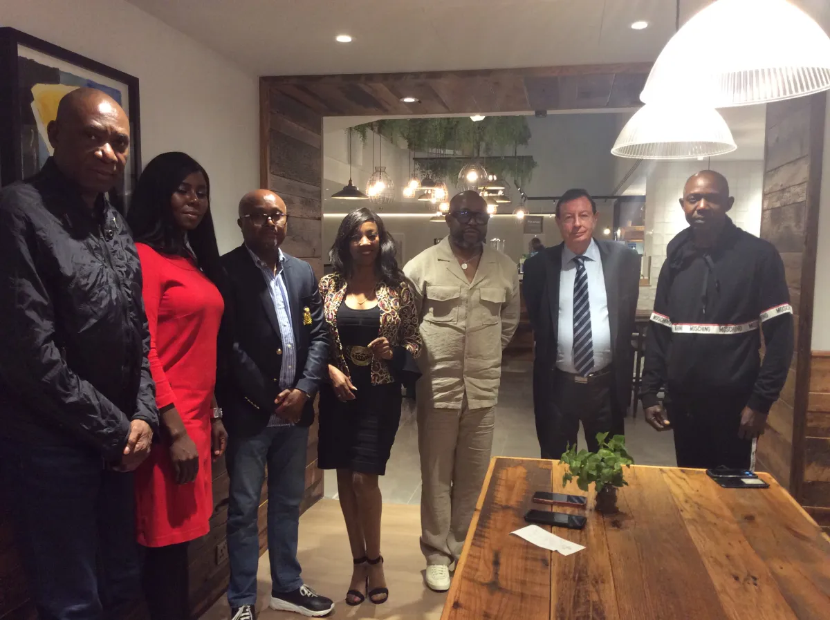 Seven guests gathered together in a restaurant after a networking meeting
